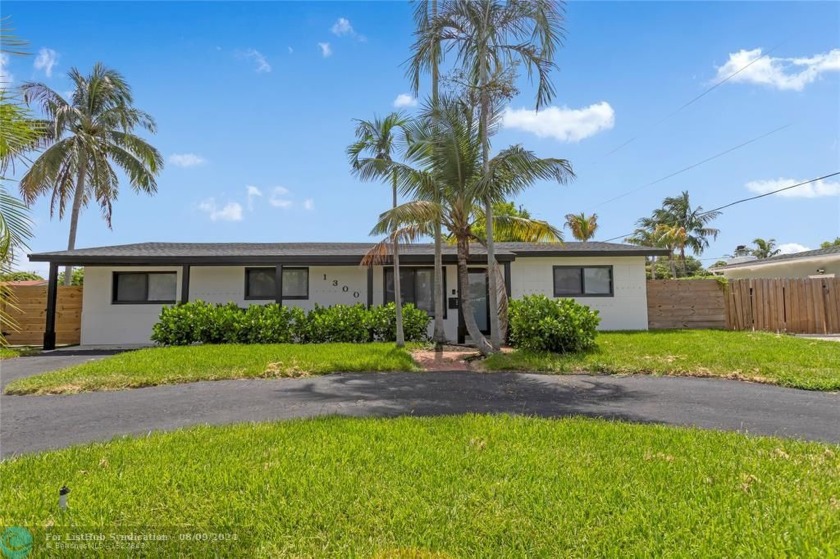 Welcome to this ultra-modern 4/2 residence situated on a - Beach Home for sale in Deerfield Beach, Florida on Beachhouse.com