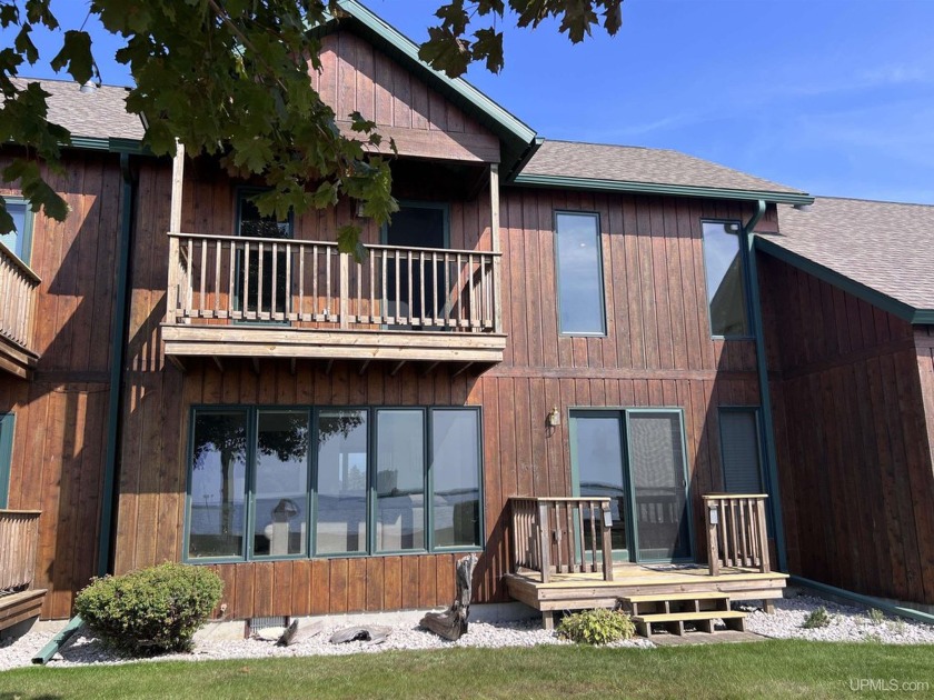 This spacious condo at Lighthouse Condominiums offers stunning - Beach Condo for sale in Manistique, Michigan on Beachhouse.com