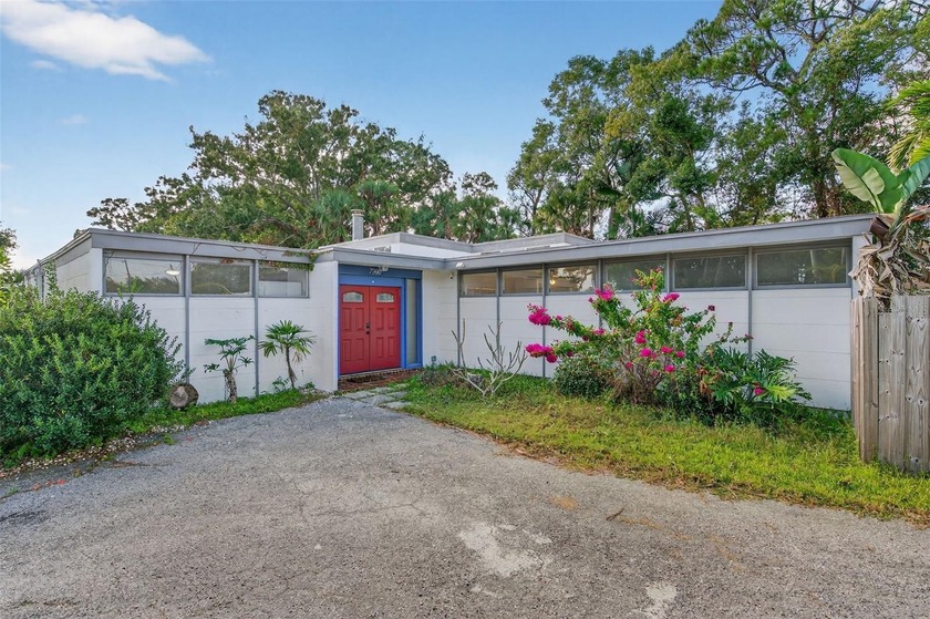 Step inside this Frank Lloyd Wright-inspired mid-century modern - Beach Home for sale in Pinellas Park, Florida on Beachhouse.com