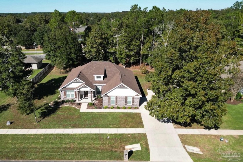 Welcome Home! This 4 bed // 3 bath brick residence sits on 1/2 - Beach Home for sale in Pace, Florida on Beachhouse.com