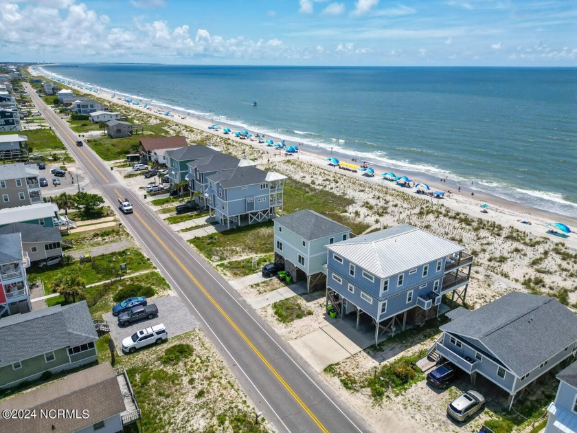 OCEAN FRONT LIVING at it's best! Custom built by current owners - Beach Home for sale in Oak Island, North Carolina on Beachhouse.com