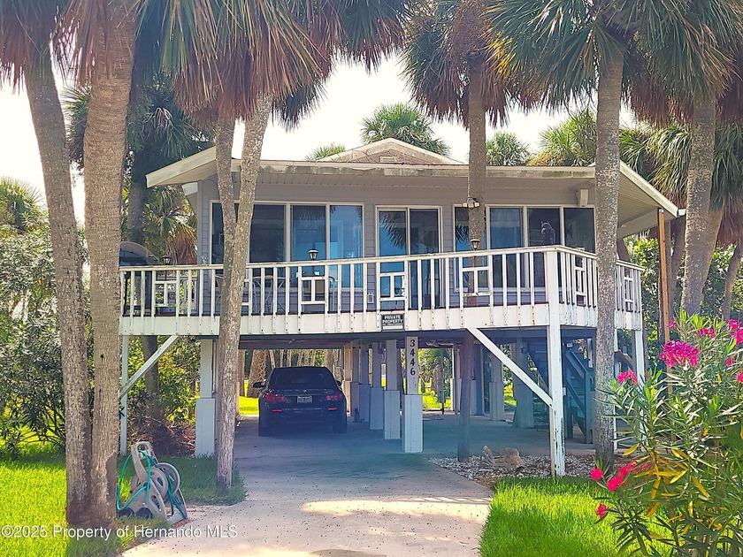 Check out this little island bungalow overlooking the beachfront - Beach Home for sale in Weeki Wachee, Florida on Beachhouse.com