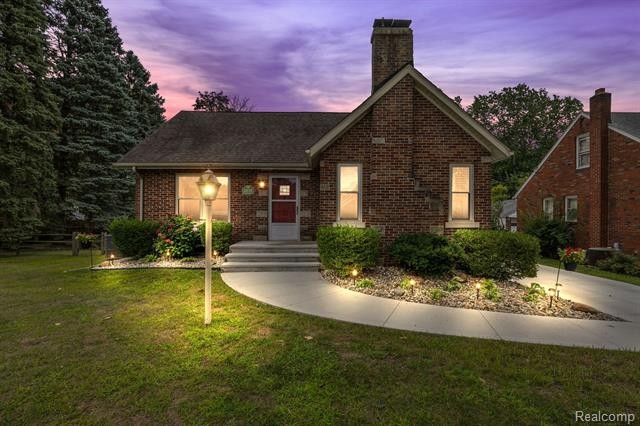 Welcome to this charming brick bungalow, situated on a generous - Beach Home for sale in Monroe, Michigan on Beachhouse.com