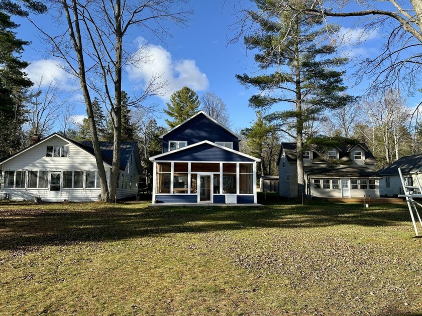 Discover the charm of this classic Mullett Lake cottage nestled - Beach Home for sale in Cheboygan, Michigan on Beachhouse.com