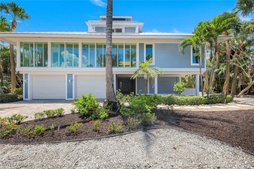 This gorgeous home offers an inviting entryway with an elevator - Beach Home for sale in Sanibel, Florida on Beachhouse.com