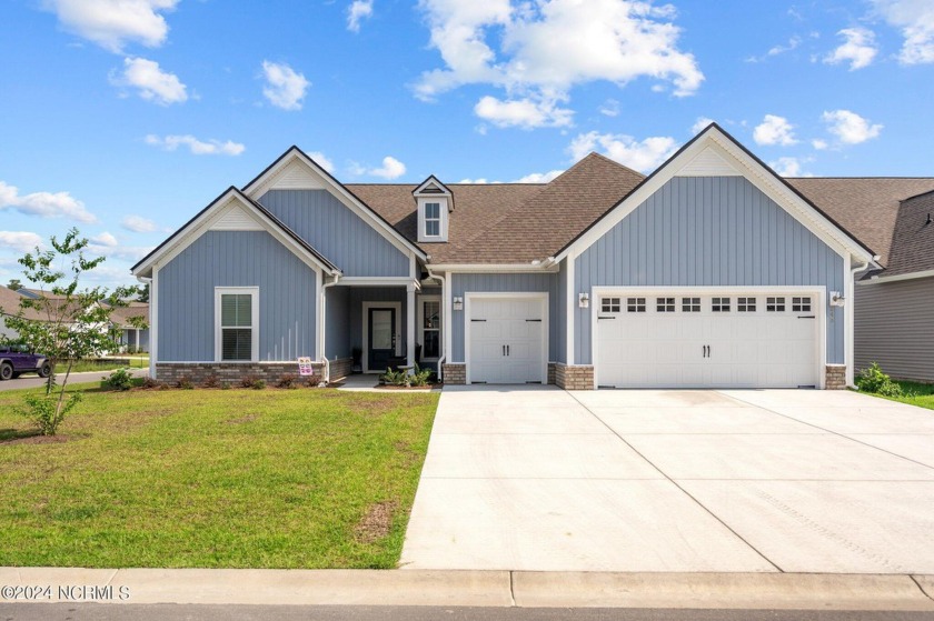 Situated on a corner lot, this beautiful home is perfect for - Beach Home for sale in Carolina Shores, North Carolina on Beachhouse.com