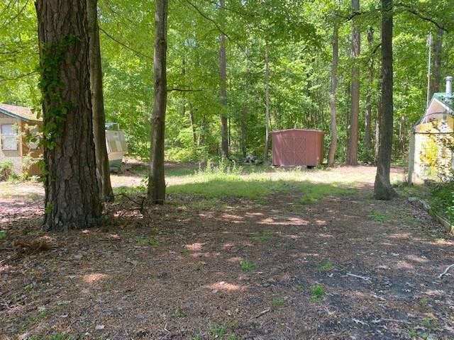 Shady lot with shed in popular Trails End.  No perc on file - Beach Lot for sale in Horntown, Virginia on Beachhouse.com
