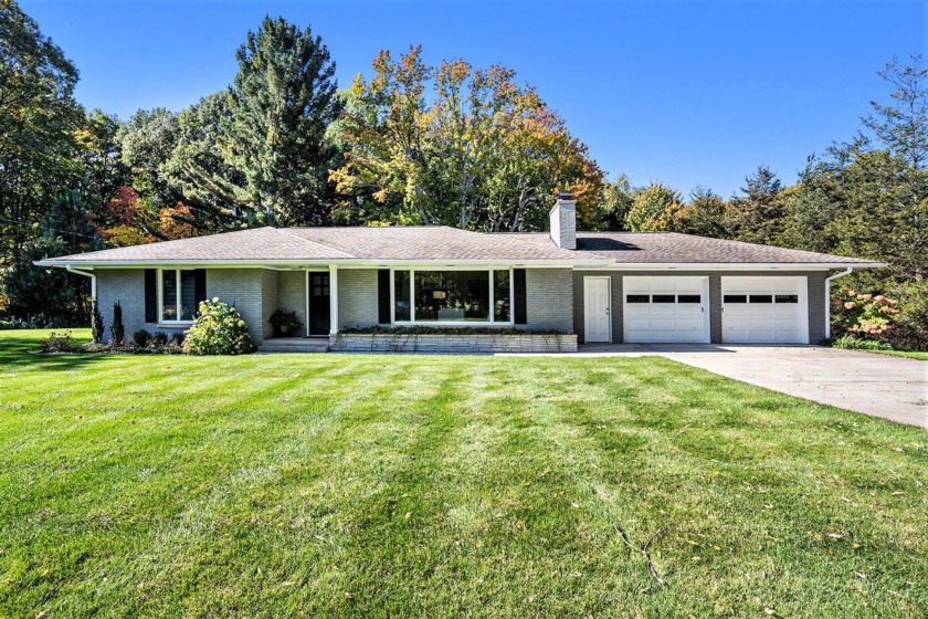 Welcome to this stunning brick Ranch in charming Grand Haven on - Beach Home for sale in Grand Haven, Michigan on Beachhouse.com