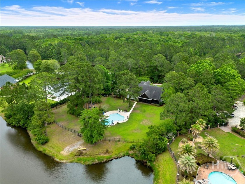 Welcome to this coveted 3 Car garage private oasis on 2.5 ACRES - Beach Home for sale in Richmond Hill, Georgia on Beachhouse.com