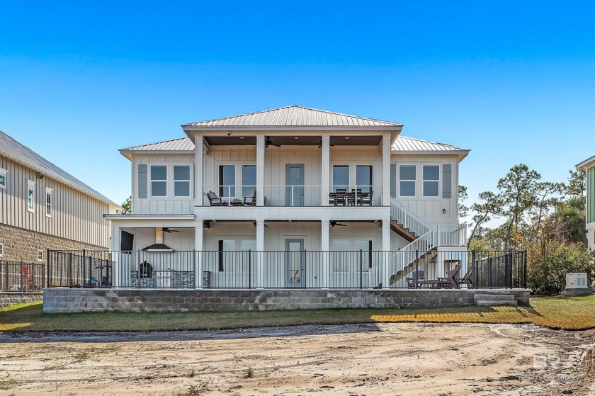 Experience the epitome of bayfront living with this - Beach Home for sale in Orange Beach, Alabama on Beachhouse.com