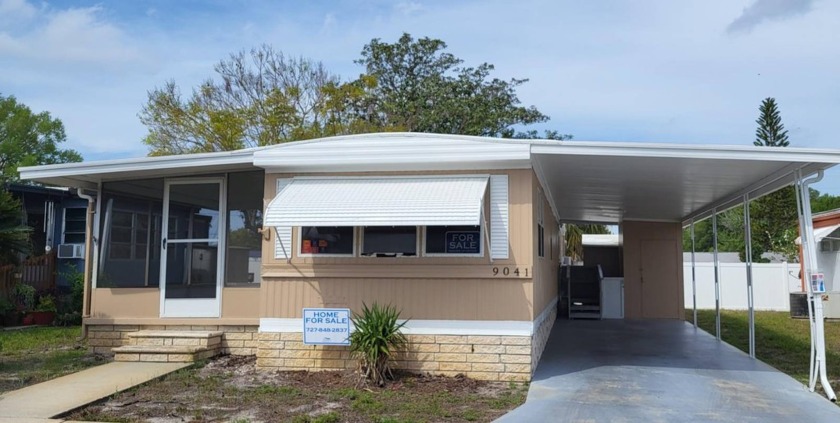 Greetings to your new quaint abode! This petite residence boasts - Beach Home for sale in Port Richey, Florida on Beachhouse.com