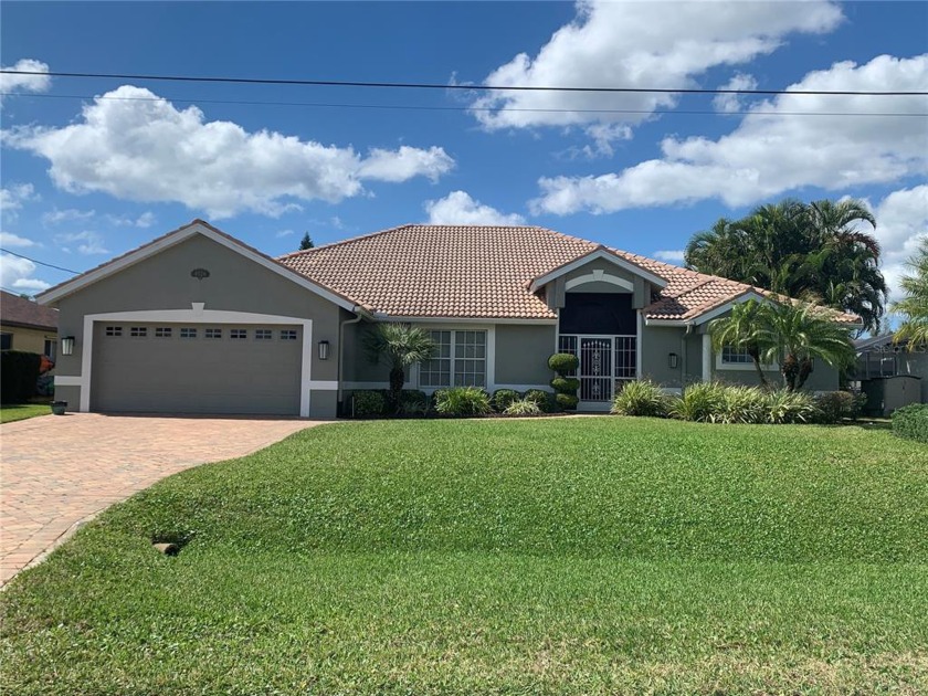 This fabulous naturally lit Gulf Access Canal home with sea wall - Beach Home for sale in Cape Coral, Florida on Beachhouse.com