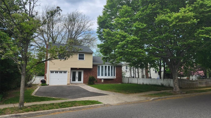 Charming 3 Bedroom, 1.5 Bath Split-Level Home in Amityville - Beach Home for sale in Amityville, New York on Beachhouse.com