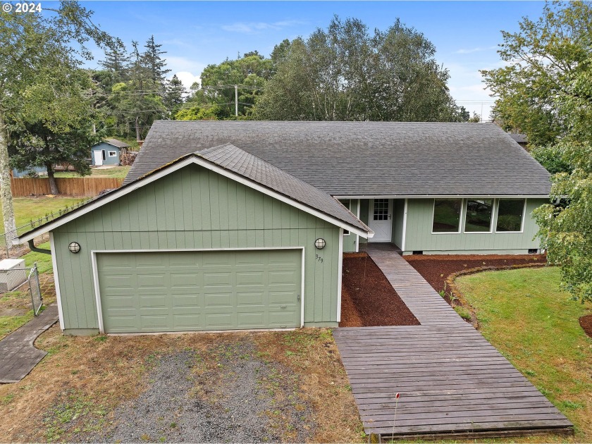 Step into this private 4-bedroom, 2-bath ranch-style home in - Beach Home for sale in Hammond, Oregon on Beachhouse.com