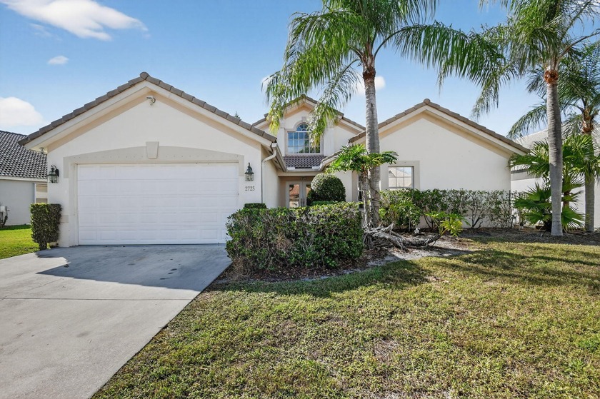 Located in a beautiful gated community with mature trees, this - Beach Home for sale in Greenacres, Florida on Beachhouse.com