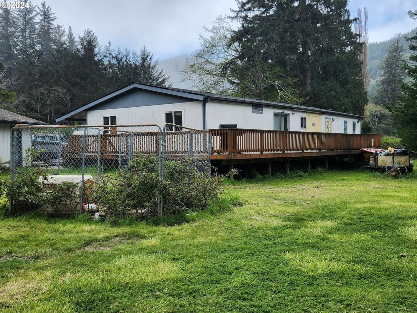 Beautiful, creekfront setting and over an acre of land!  The - Beach Home for sale in Gold Beach, Oregon on Beachhouse.com