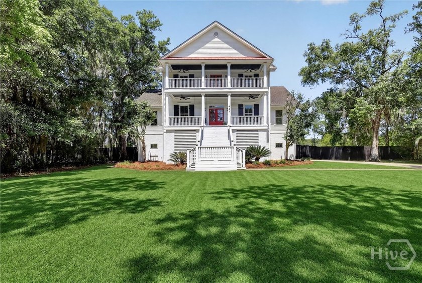 Classic Southern charm and marshfront living! Nestled on a - Beach Home for sale in Richmond Hill, Georgia on Beachhouse.com