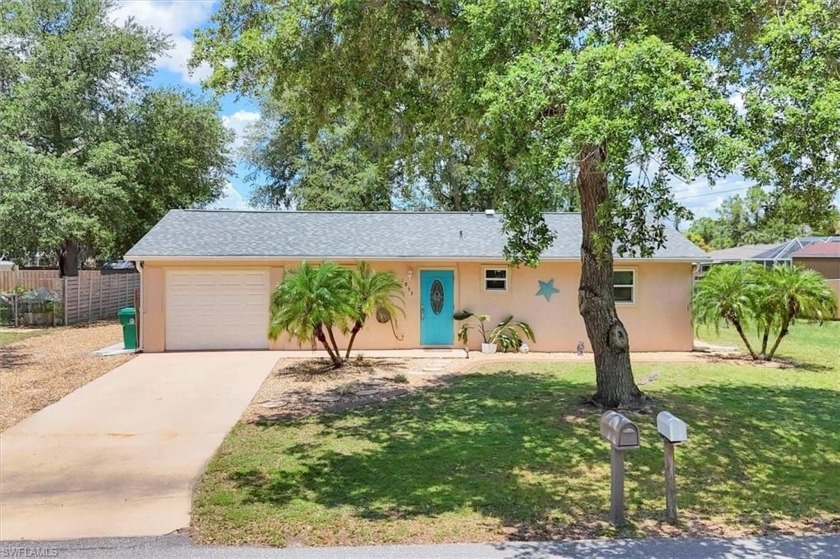 Nestled on a quaint, treelined street draped with Spanish moss - Beach Home for sale in Port Charlotte, Florida on Beachhouse.com