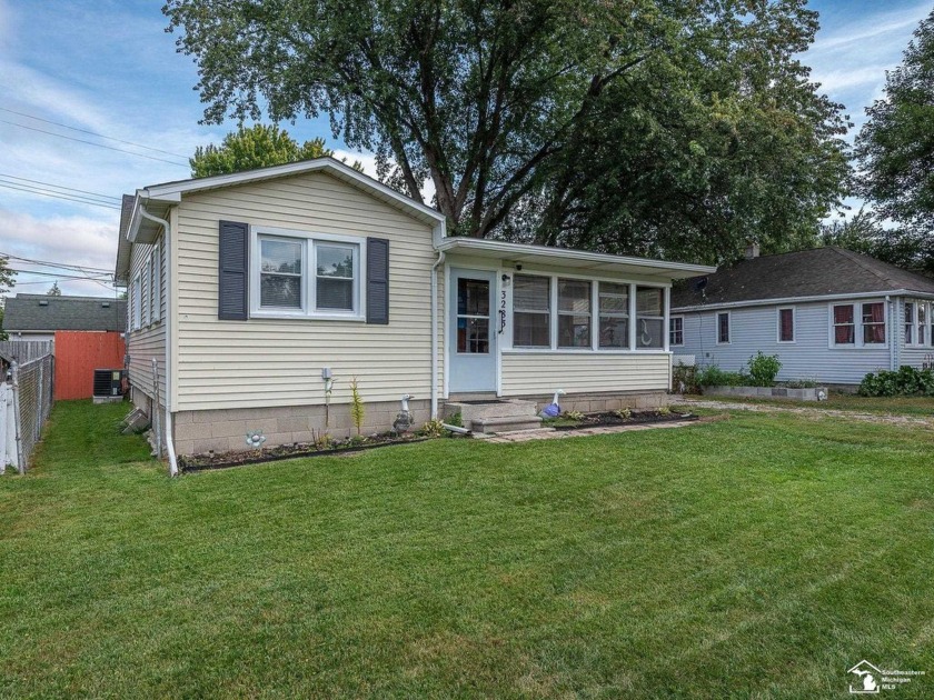 This charming two-bedroom home is nestled in a welcoming - Beach Home for sale in Monroe, Michigan on Beachhouse.com