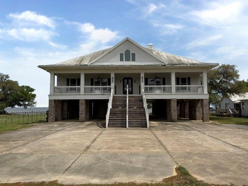 Check out this large beach house set on Mobile Bay! This - Beach Home for sale in Theodore, Alabama on Beachhouse.com