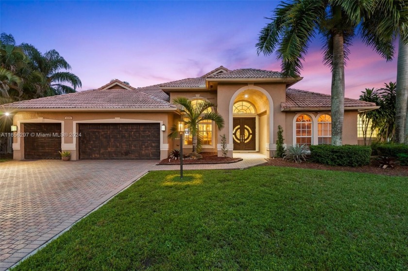 Welcome to this stunning 5-bedroom, 3.5-bath home situated on an - Beach Home for sale in Pembroke Pines, Florida on Beachhouse.com