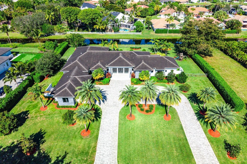 An extraordinary single-story estate offering soaring 13-foot - Beach Home for sale in Boca Raton, Florida on Beachhouse.com