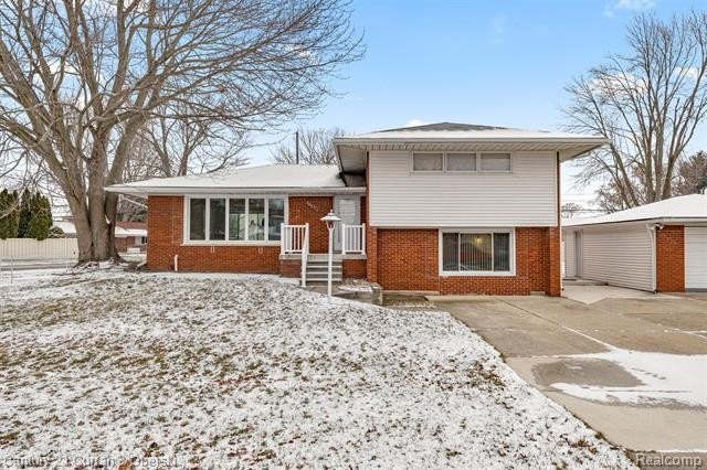 Step into this completely updated quad-level home on a spacious - Beach Home for sale in Gibraltar, Michigan on Beachhouse.com