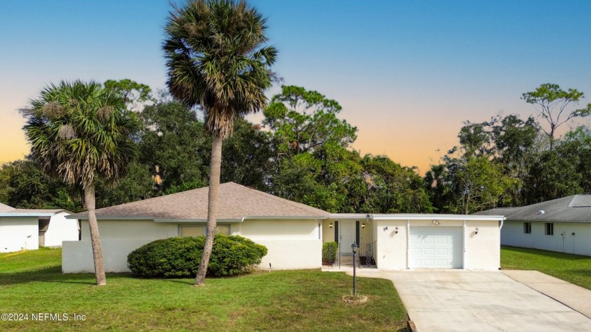 Welcome to this charming ranch-style home in the desirable Palm - Beach Home for sale in Palm Coast, Florida on Beachhouse.com