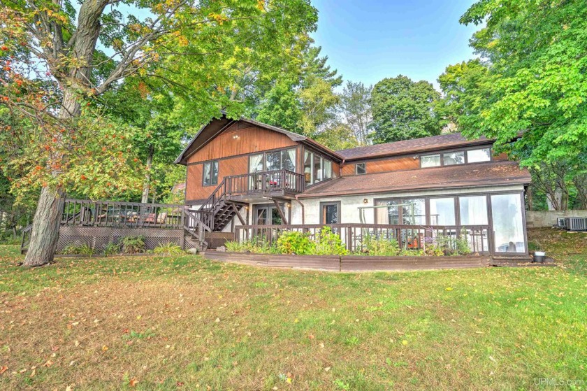 Discover lakeside luxury at this exceptional waterfront home on - Beach Home for sale in Manistique, Michigan on Beachhouse.com