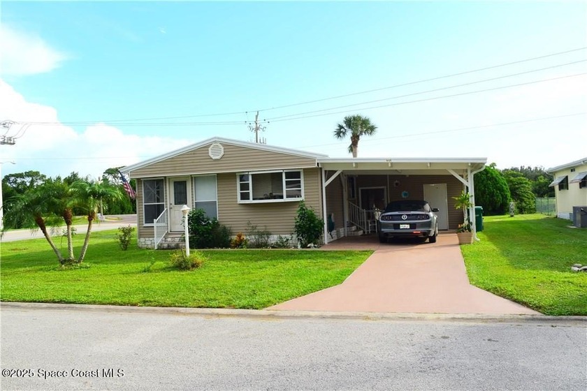 This cozy corner-lot home is full of potential and ready for - Beach Home for sale in Barefoot Bay, Florida on Beachhouse.com