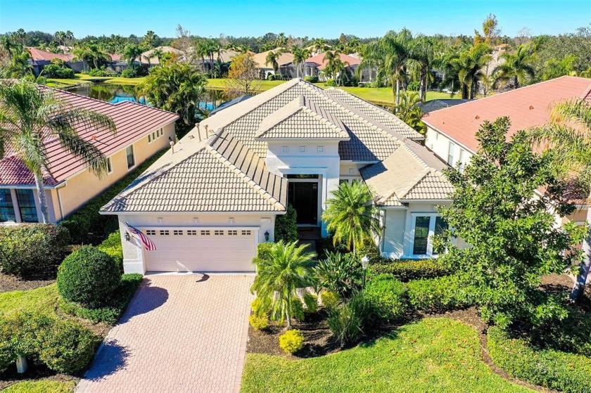 Nestled on a premier lake home site, this maintenance-free home - Beach Home for sale in Lakewood Ranch, Florida on Beachhouse.com