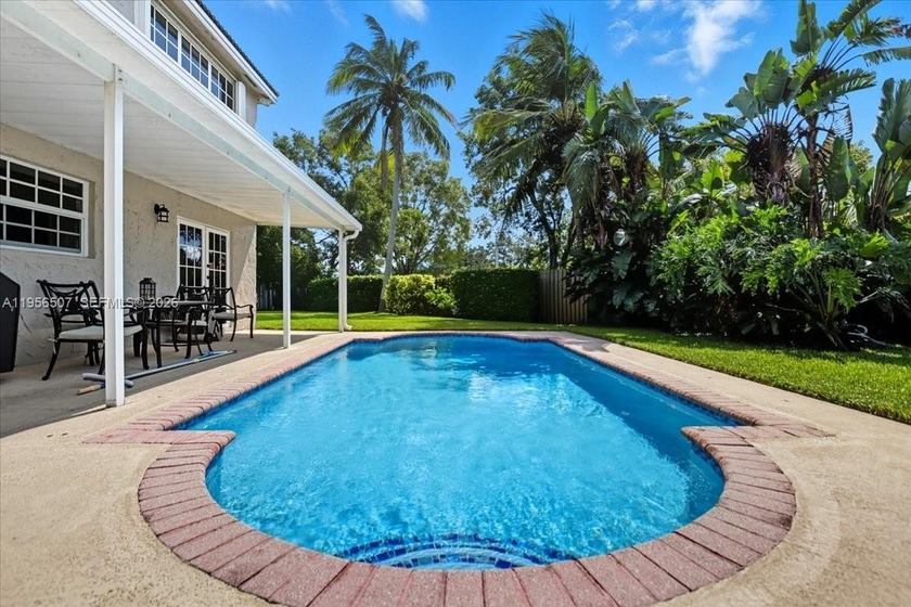 Stunning Pool Home in the sought-after *Homes at Forest Lake* - Beach Home for sale in Cooper City, Florida on Beachhouse.com