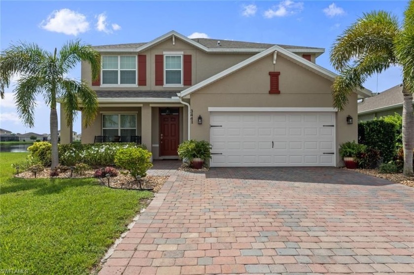 Nestled on a quiet cul-de-sac with expansive lake views, this - Beach Home for sale in Cape Coral, Florida on Beachhouse.com