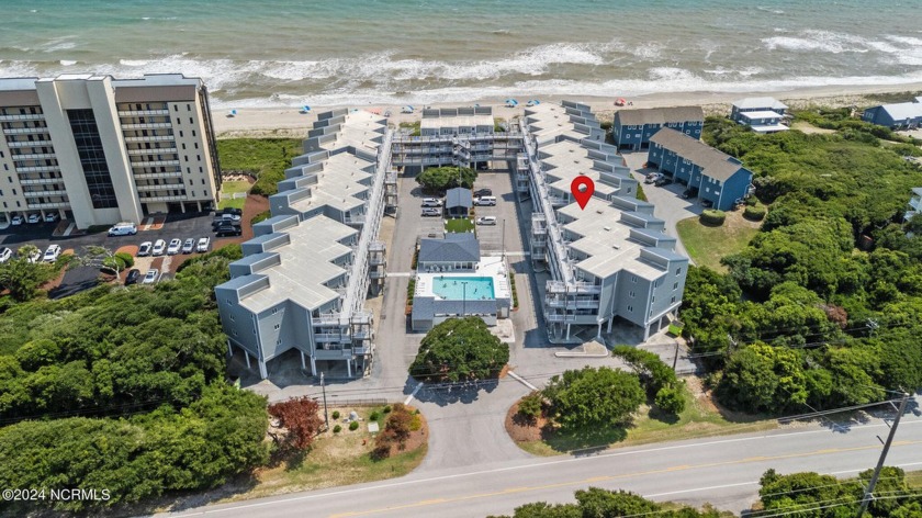 This stunning top-floor furnished unit in the Colony by the Sea - Beach Condo for sale in Indian Beach, North Carolina on Beachhouse.com
