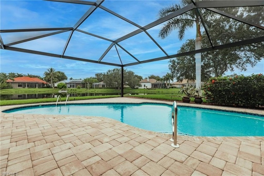 WELCOME HOME to Longshore Lake's most exquisite 4-Bedroom, 3 - Beach Home for sale in Naples, Florida on Beachhouse.com