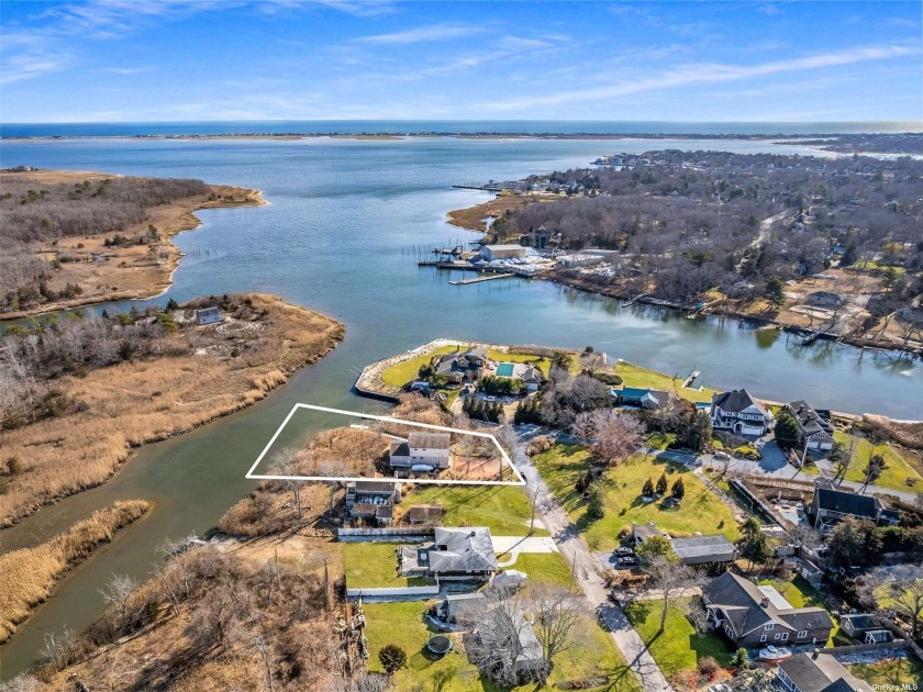 Located on Weesuck Creek and overlooking Shinnecock Bay, 13 - Beach Home for sale in East Quogue, New York on Beachhouse.com