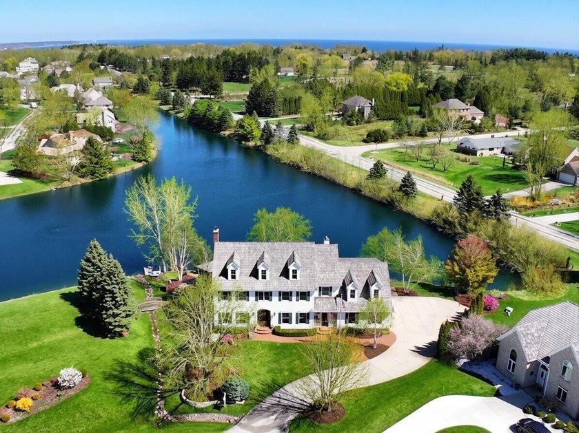 Exceptional curb appeal & refined finishes define this expansive - Beach Home for sale in Mequon, Wisconsin on Beachhouse.com