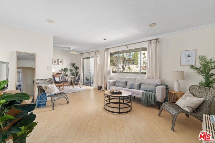 Enveloped in windows and abundant light on three sides, this - Beach Condo for sale in Santa Monica, California on Beachhouse.com