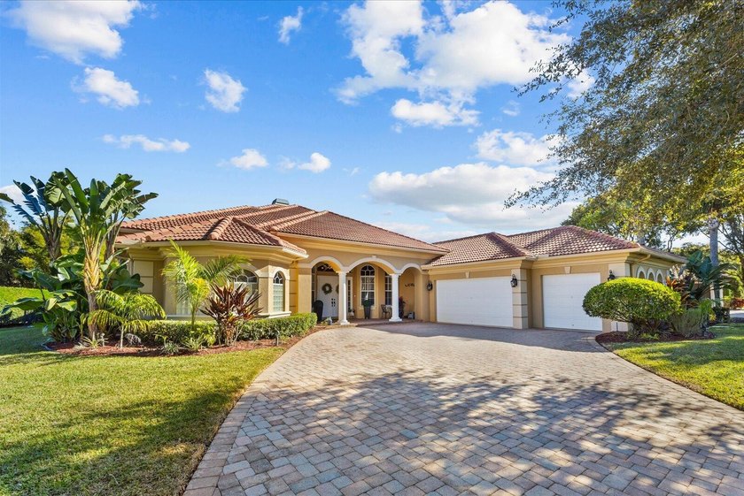 Experience luxury and privacy in this stunning home set on .67 - Beach Home for sale in Palm City, Florida on Beachhouse.com