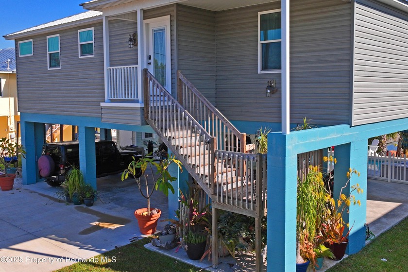 This elevated 2022 Gulfstream Homes custom build delivers modern - Beach Home for sale in Hernando Beach, Florida on Beachhouse.com