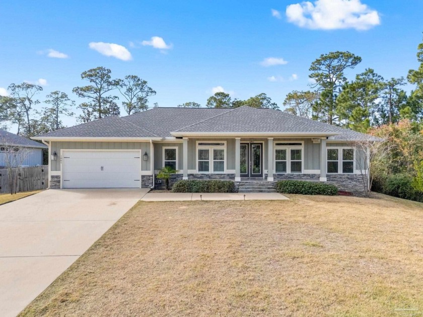 This modern Craftsman-style pool home, on a beautiful lot in - Beach Home for sale in Gulf Breeze, Florida on Beachhouse.com