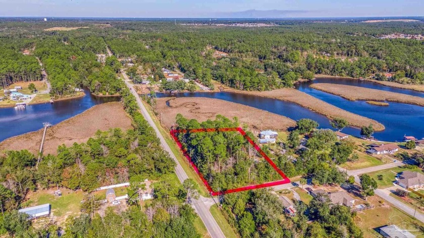 Nestled on nearly half an acre of serene waterfront property - Beach Lot for sale in Milton, Florida on Beachhouse.com