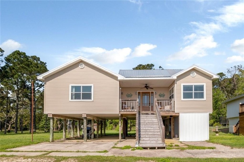 Charming coastal cottage just minutes from the water! This - Beach Home for sale in Coden, Alabama on Beachhouse.com