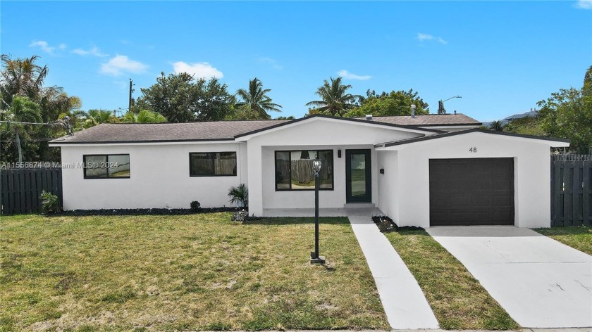 Welcome to this beautifully renovated 4 bedroom, 3 bathrooms and - Beach Home for sale in Dania, Florida on Beachhouse.com