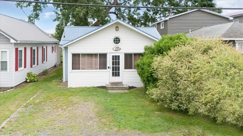 Sit back relax and let this little waterfront community home - Beach Home for sale in Sodus, New York on Beachhouse.com