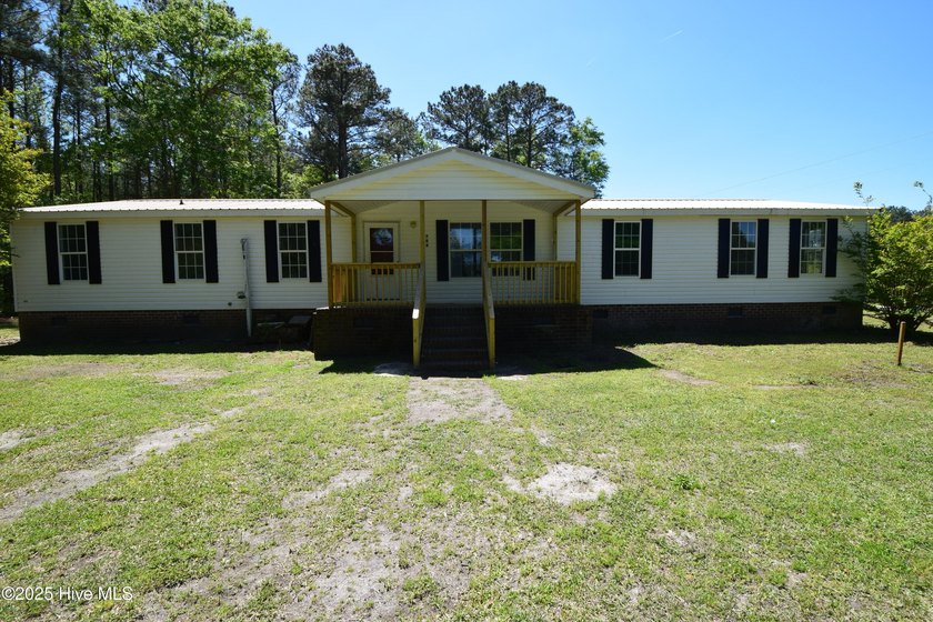 Large, four-bedroom doublewide with a metal roof on nice, 0.91 - Beach Home for sale in Blounts Creek, North Carolina on Beachhouse.com
