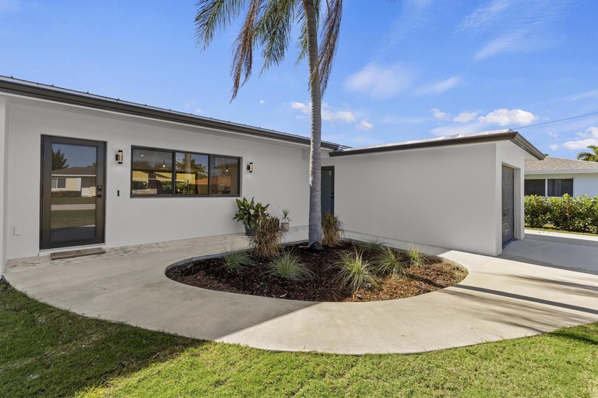 Welcome to this extensively renovated 3-bedroom, 2-bathroom - Beach Home for sale in Lake Clarke Shores, Florida on Beachhouse.com