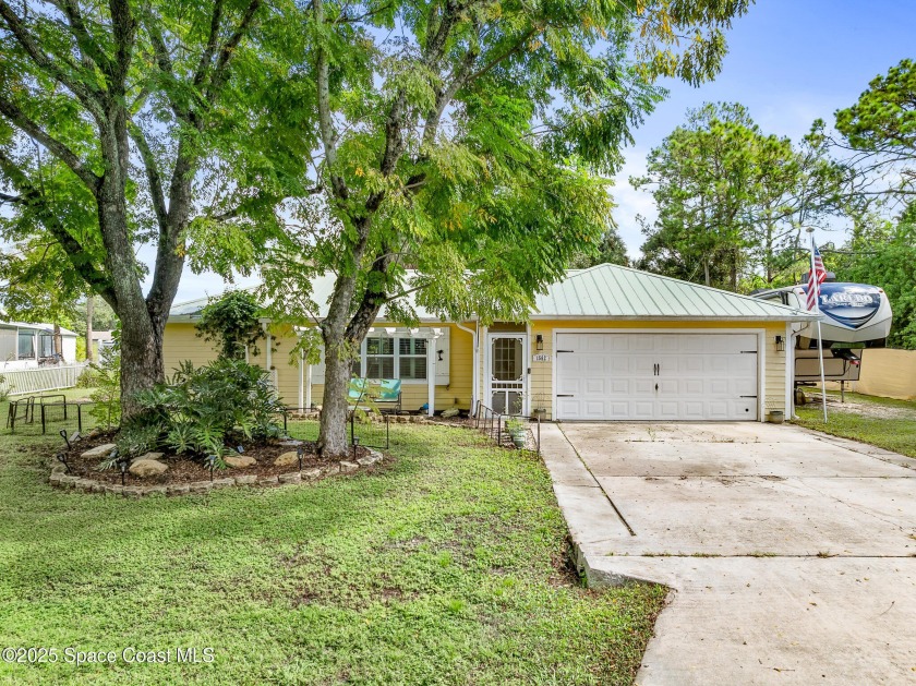 Welcome to this charming four-bedroom, two-bathroom home on a - Beach Home for sale in Palm Bay, Florida on Beachhouse.com