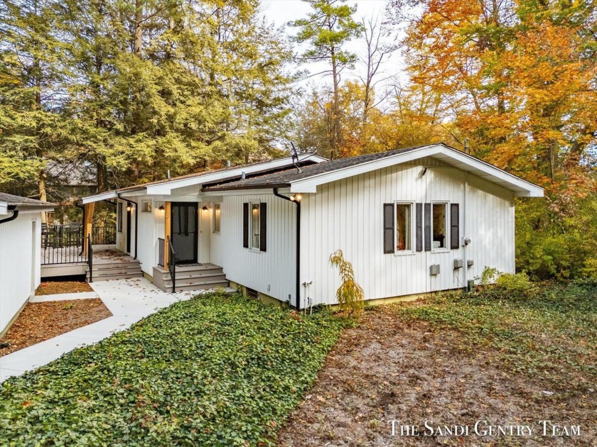 Enjoy the privacy of this charming 3-bedroom, 1.5-bath ranch - Beach Home for sale in Spring Lake, Michigan on Beachhouse.com