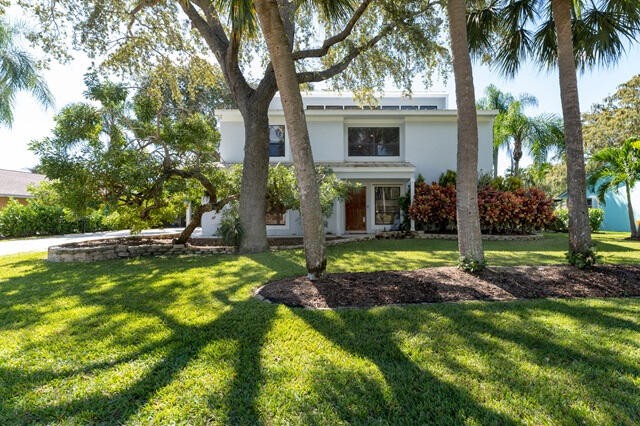 Nestled in Palm Beach Gardens, this Key West style residence is - Beach Home for sale in West Palm Beach, Florida on Beachhouse.com
